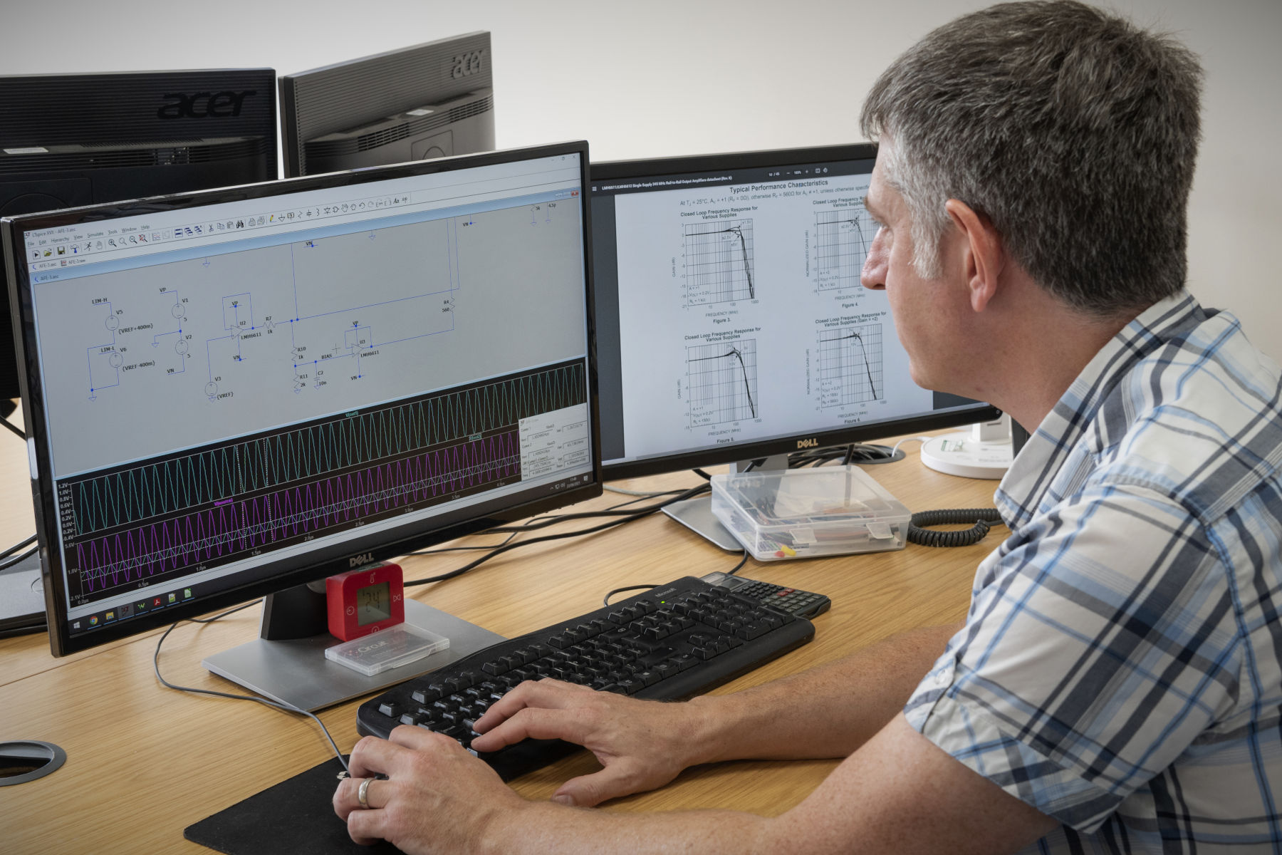 Engineer performing SPICE circuit modelling analysis