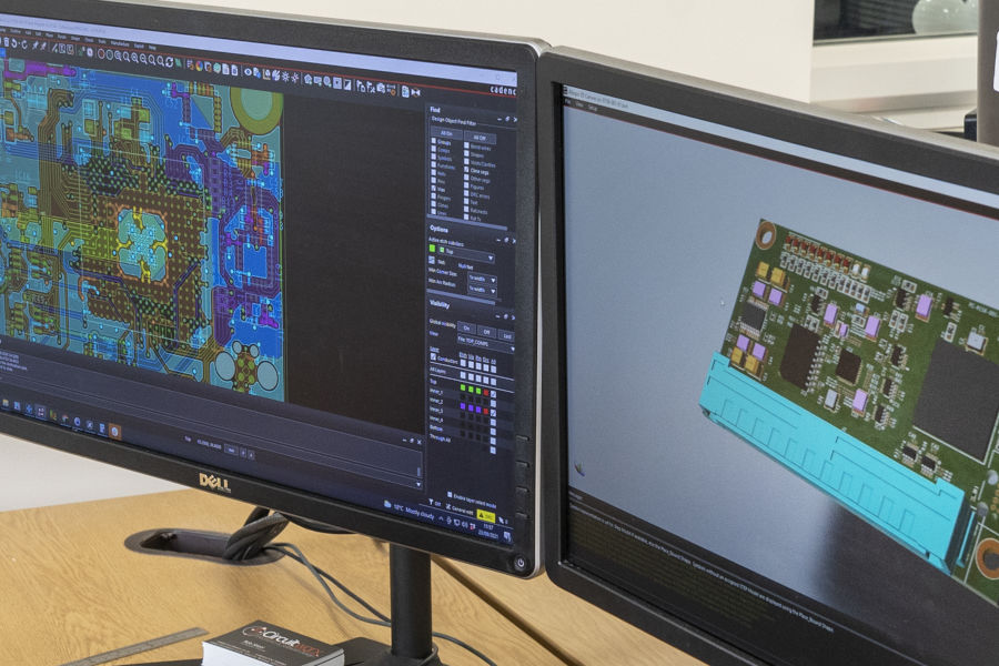 Monitors showing 3D CAD PCB layout design