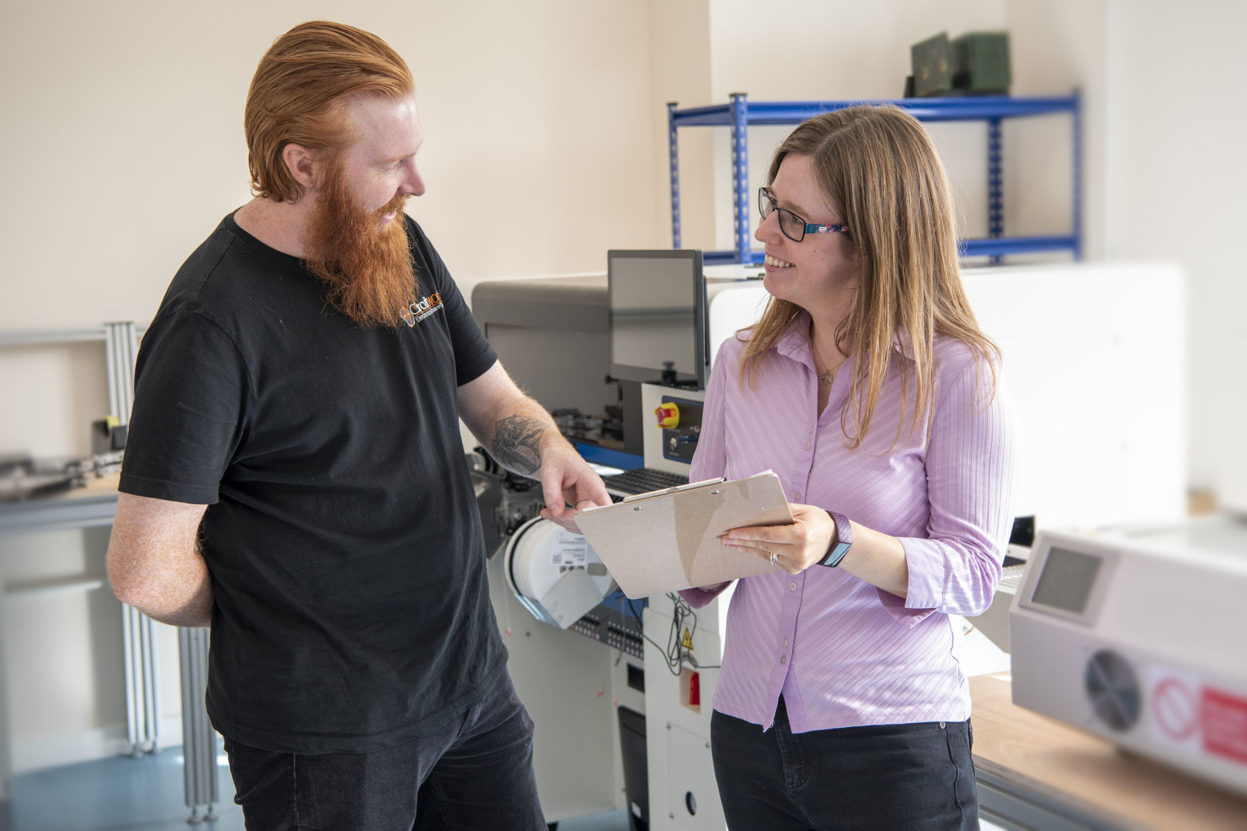 Quality Manager and Technician discussing internal quality checks