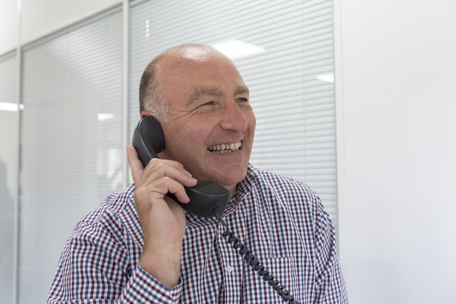 Account Manager on phone to client