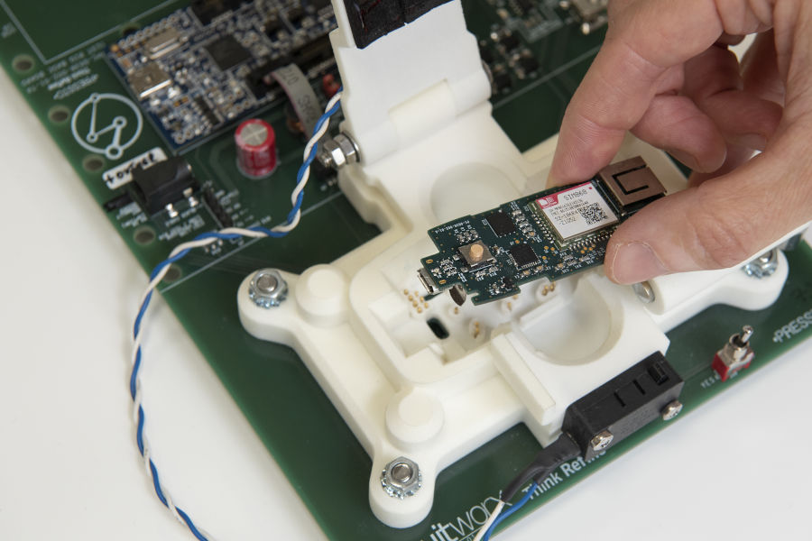 PCB incorporating wireless communications technology being placed into test rig